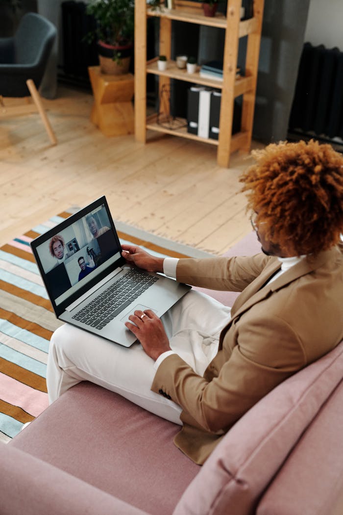 Businessman conducting a video call from home office on a laptop.